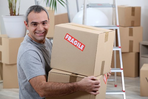 Professional packing service for a Camden home move with labelled boxes