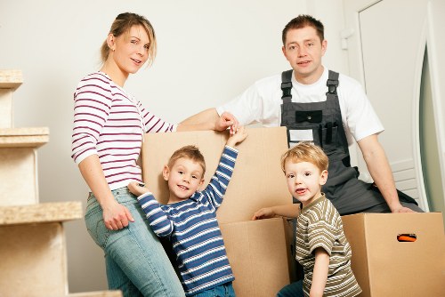 Business move preparation with labelled boxes and office furniture