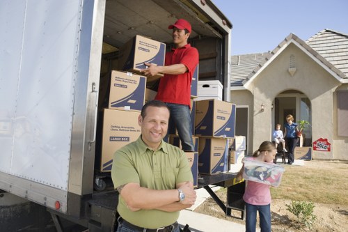 Moving van positioned near Camden properties with narrow street access