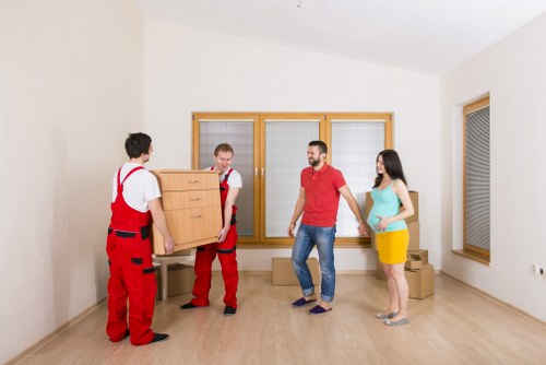 Furniture removals team working in a Camden street with bulky items