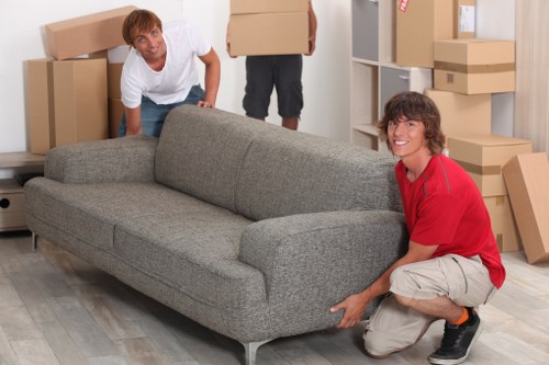 Worker assessing a delivery route and handling hazards before lifting items