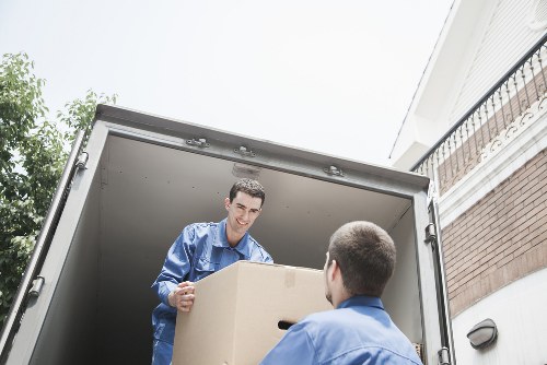 Packed boxes and furniture ready for an urgent Camden removal